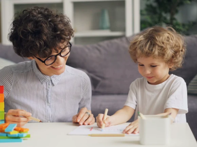teacher and child writing image